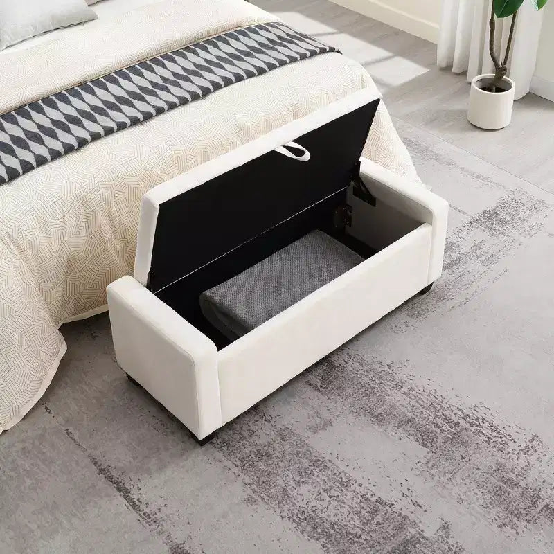 48 Pouf de rangement tapissé